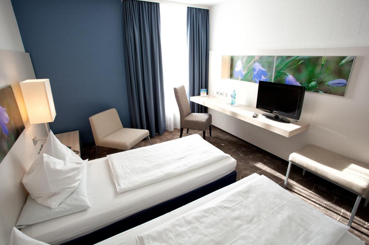 H+ Hotel Зіген Номер фото
